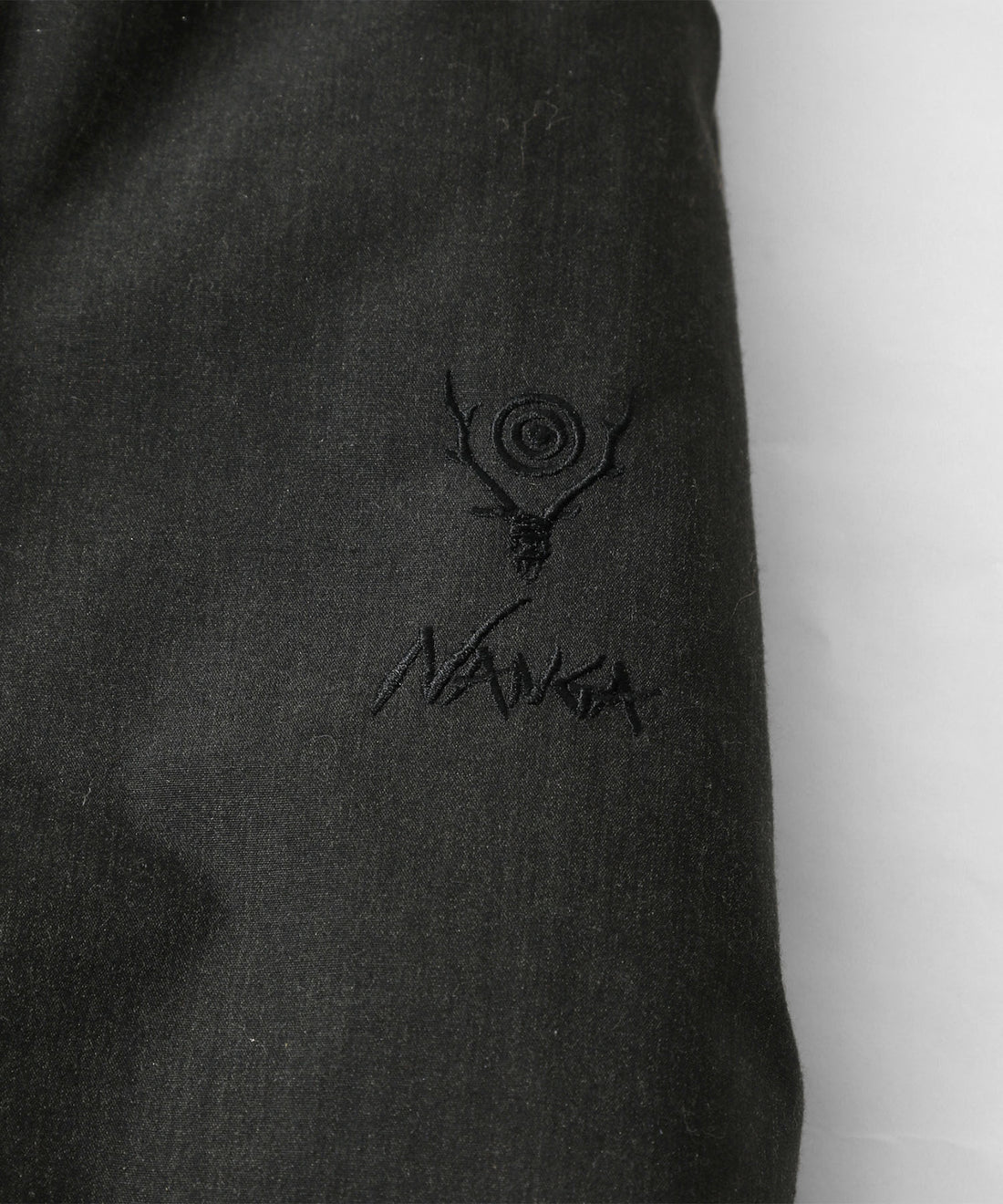 South2 West8 x NANGA Tenkara ダウンジャケット